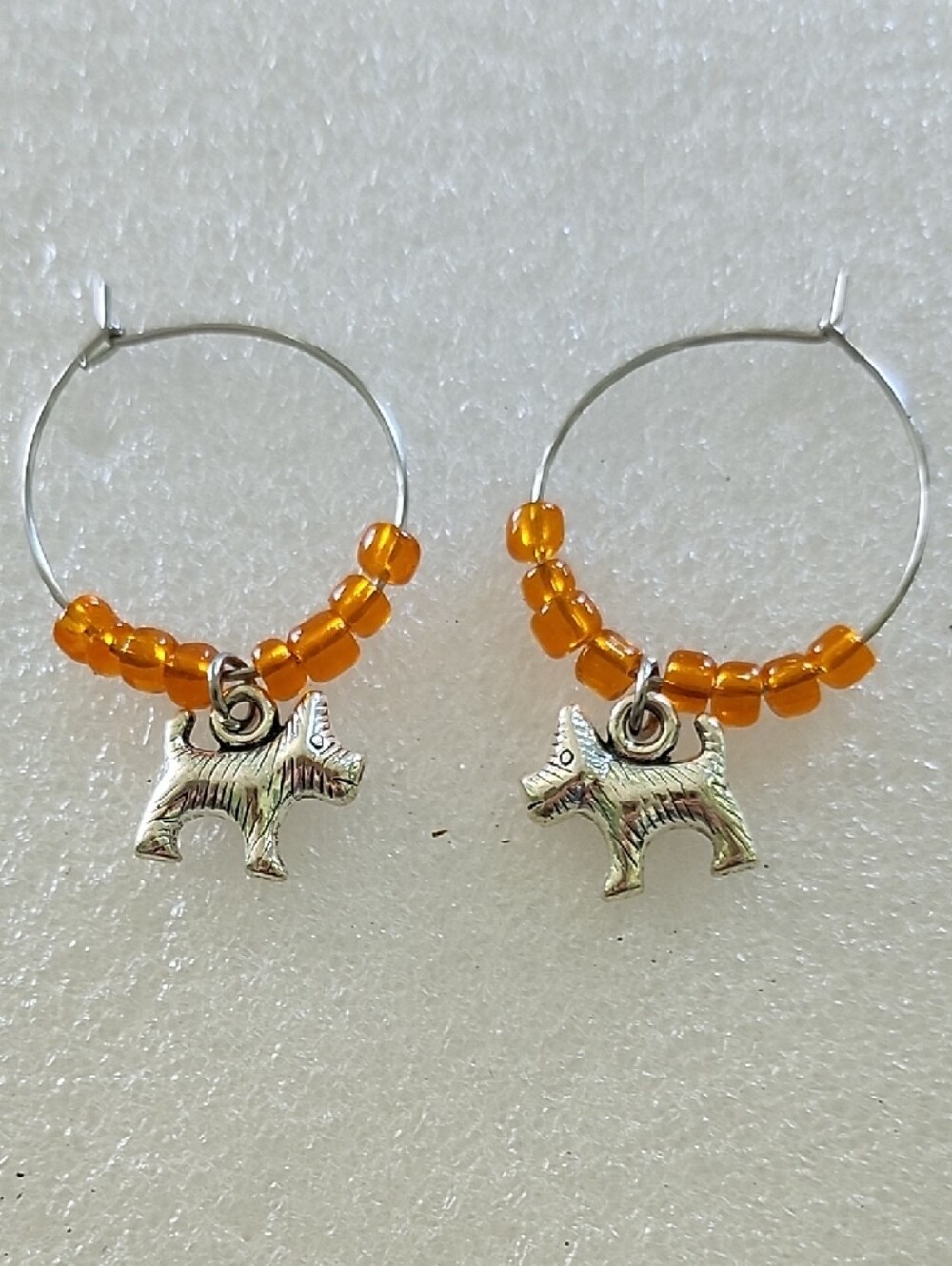 Hand Crafted Silver Dog Charm Hoop Earrings with Orange Beads